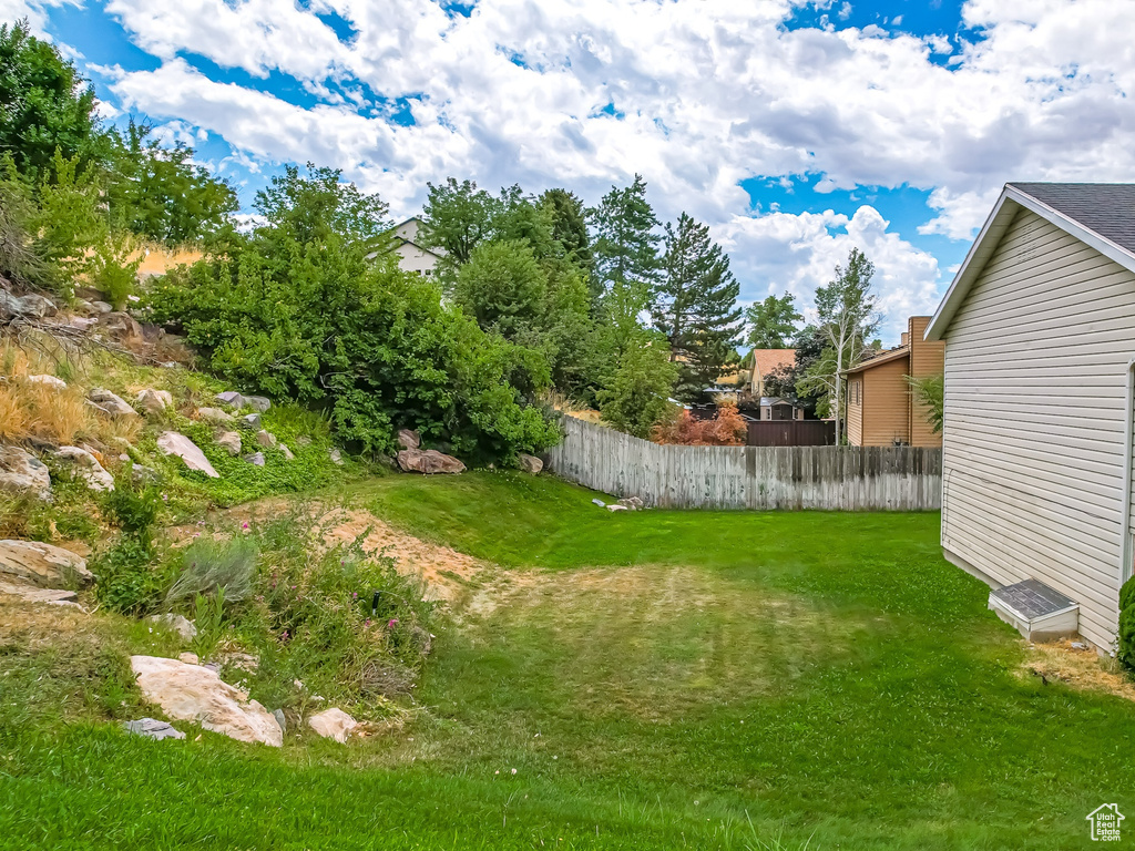 View of yard with fence