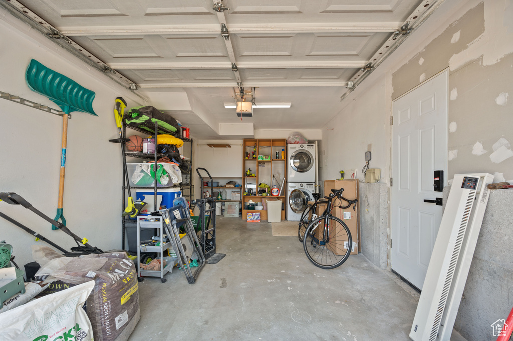 Garage with stacked washer and clothes dryer