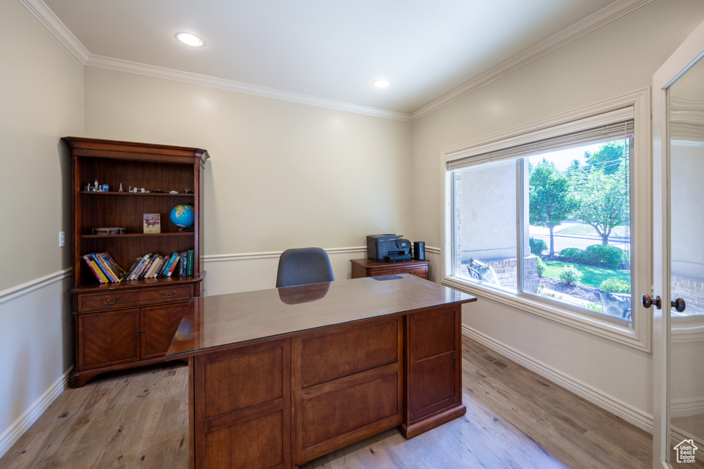 Office featuring light wood finished floors, crown molding, and recessed lighting