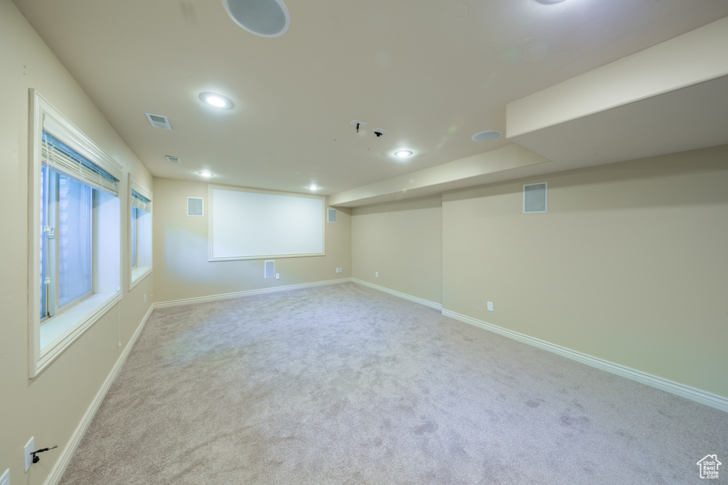 Below grade area featuring carpet floors and recessed lighting