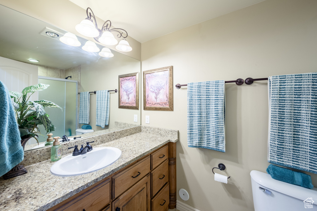 Full bath with vanity and a stall shower