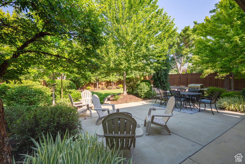 Fenced backyard featuring a patio and outdoor dining space