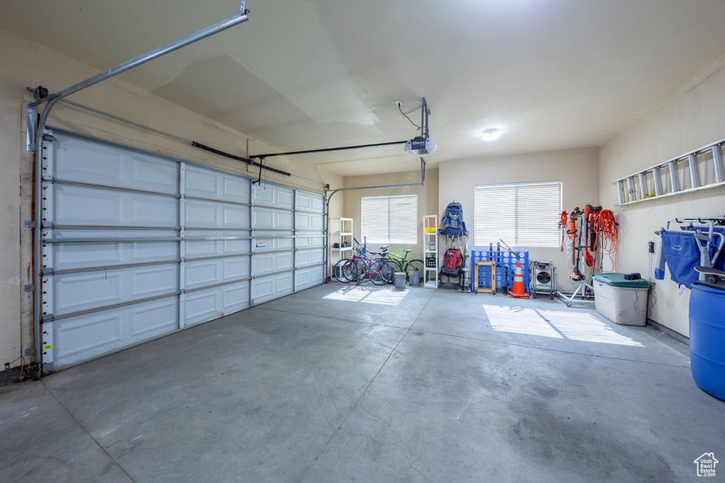 Garage featuring a garage door opener