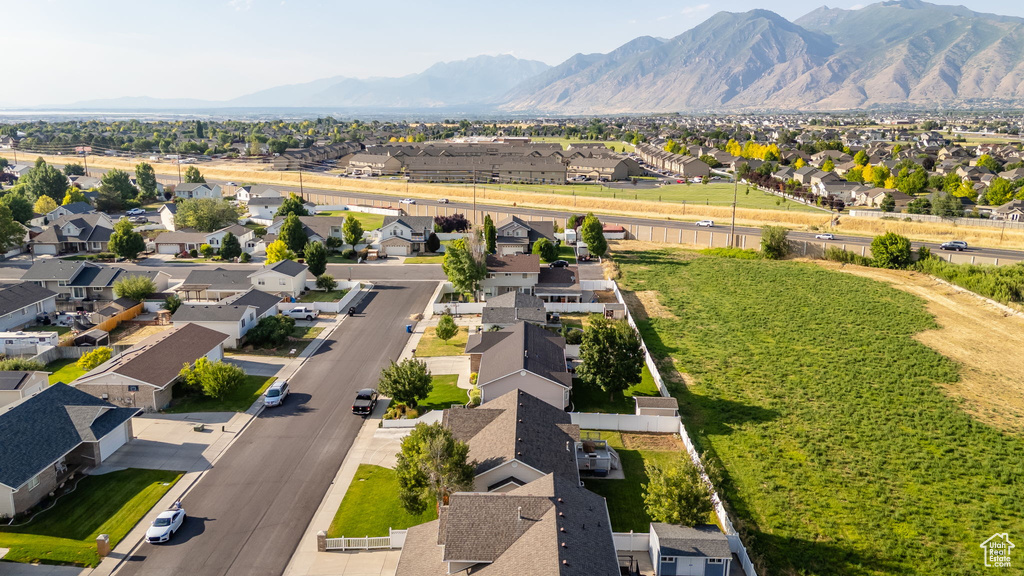 Aerial perspective of suburban area with a mountain backdrop