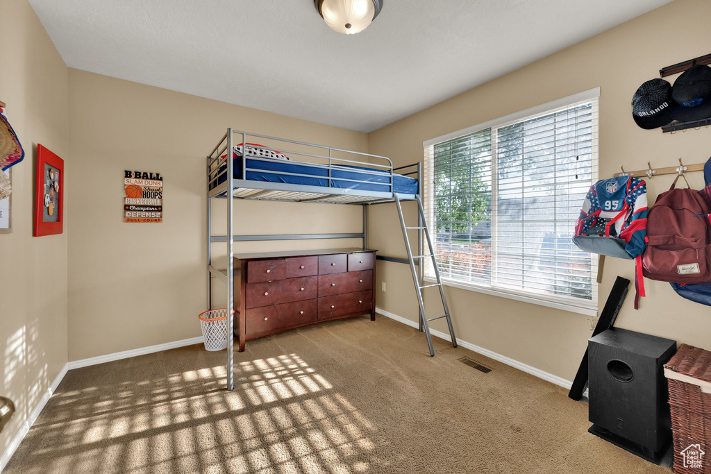 Bedroom with carpet and baseboards
