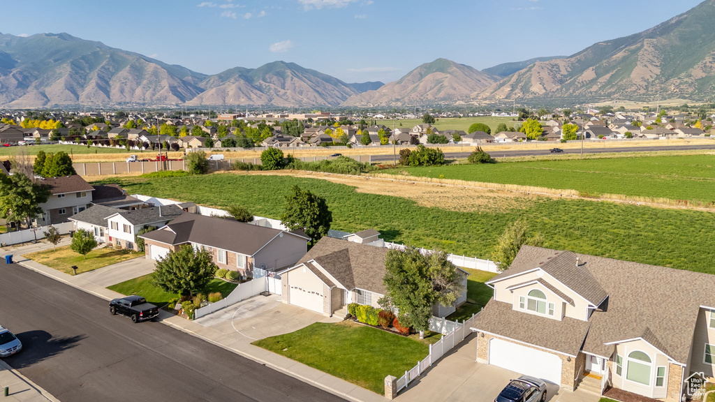 View of mountain backdrop featuring nearby suburban area