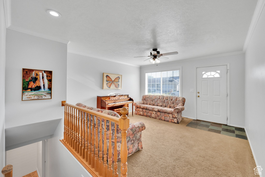 Living area with a ceiling fan, crown molding, carpet, and recessed lighting
