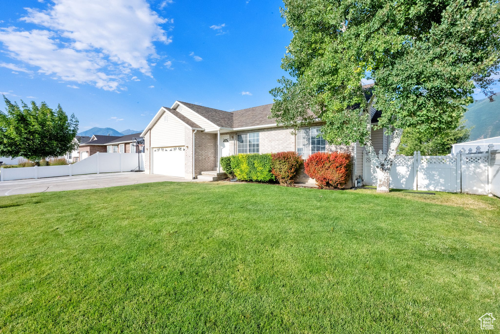 Ranch-style house with brick siding, concrete driveway, and a garage