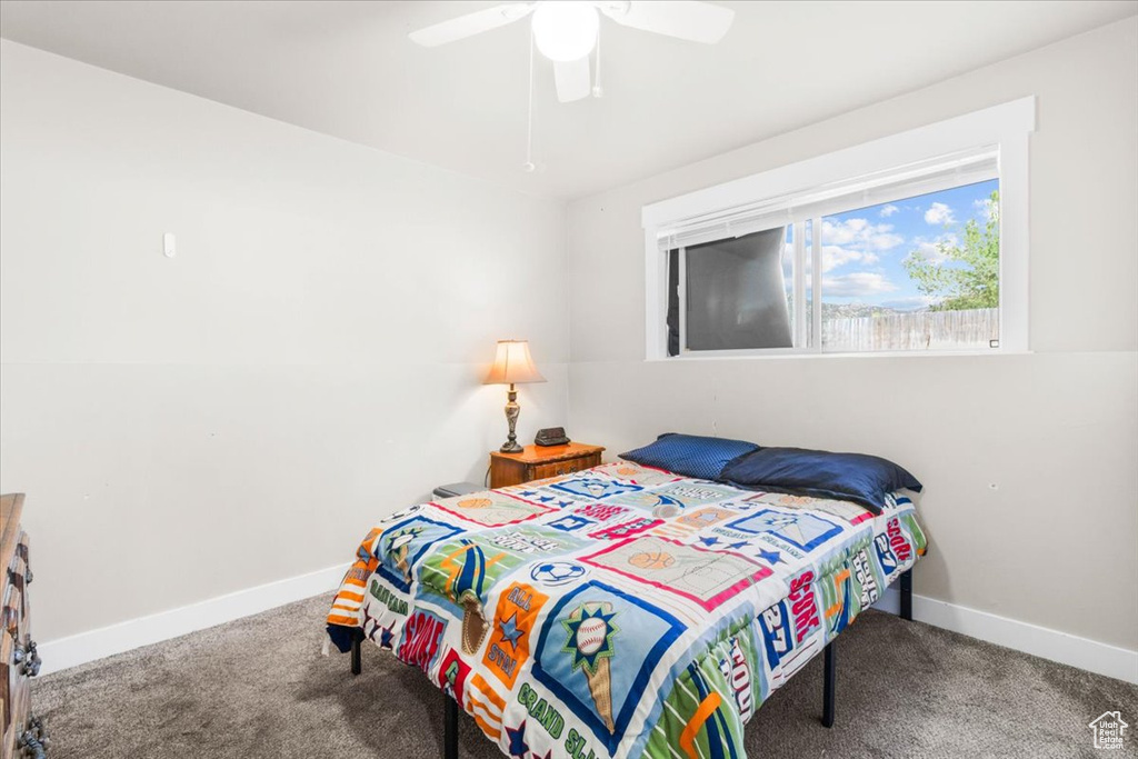 Bedroom featuring carpet flooring and ceiling fan