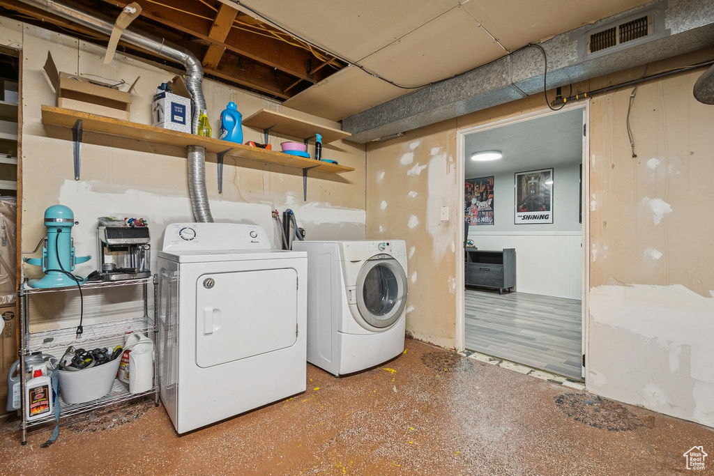 Washroom featuring independent washer and dryer