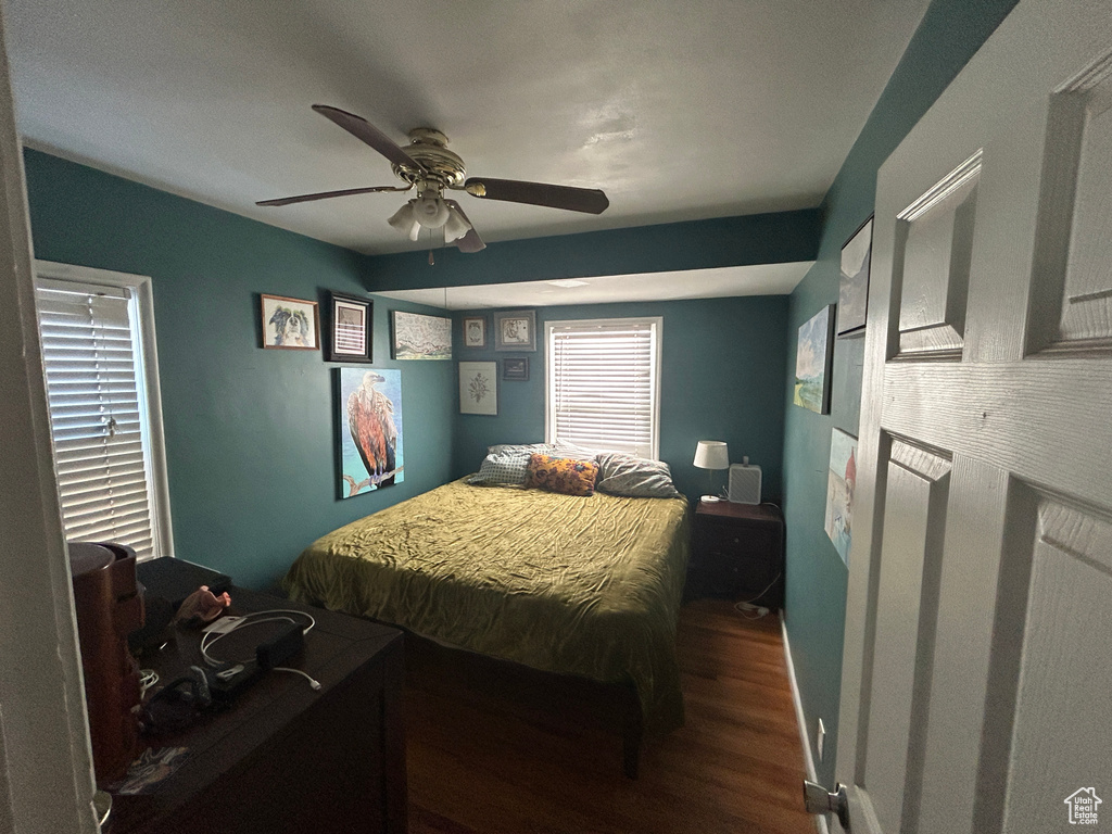 Bedroom featuring wood finished floors and ceiling fan
