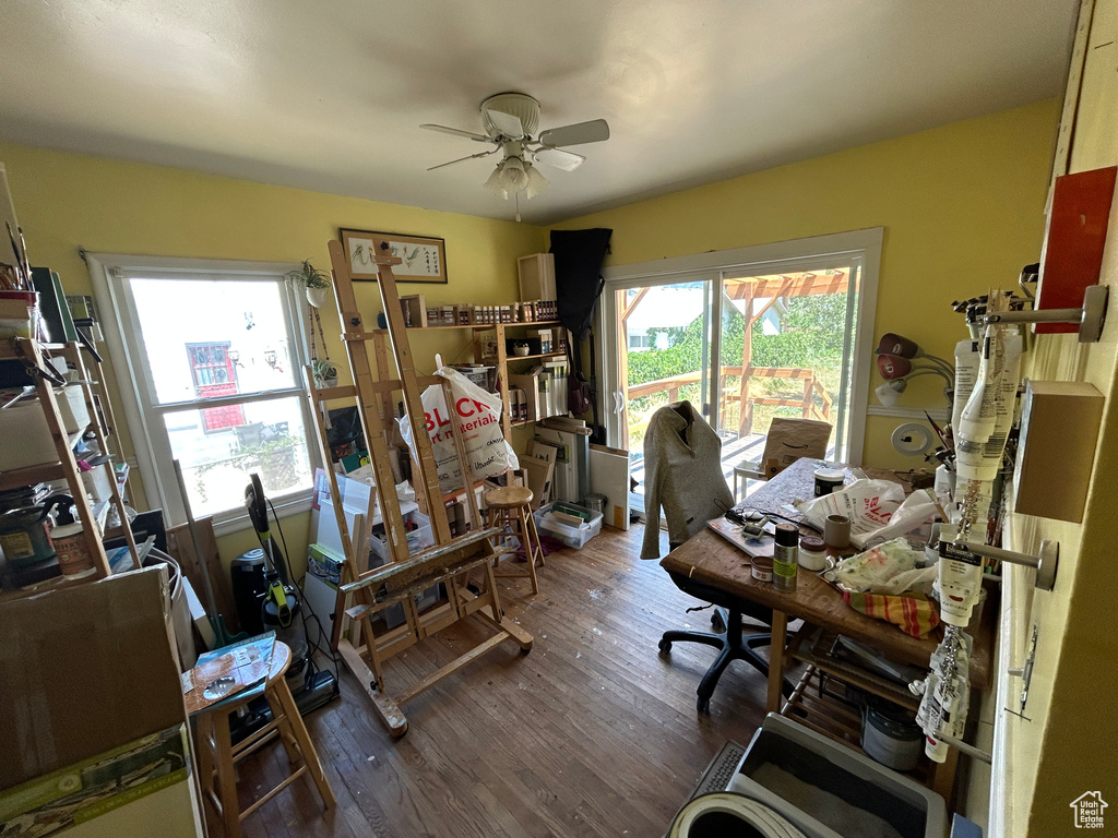 Office with a ceiling fan and wood finished floors