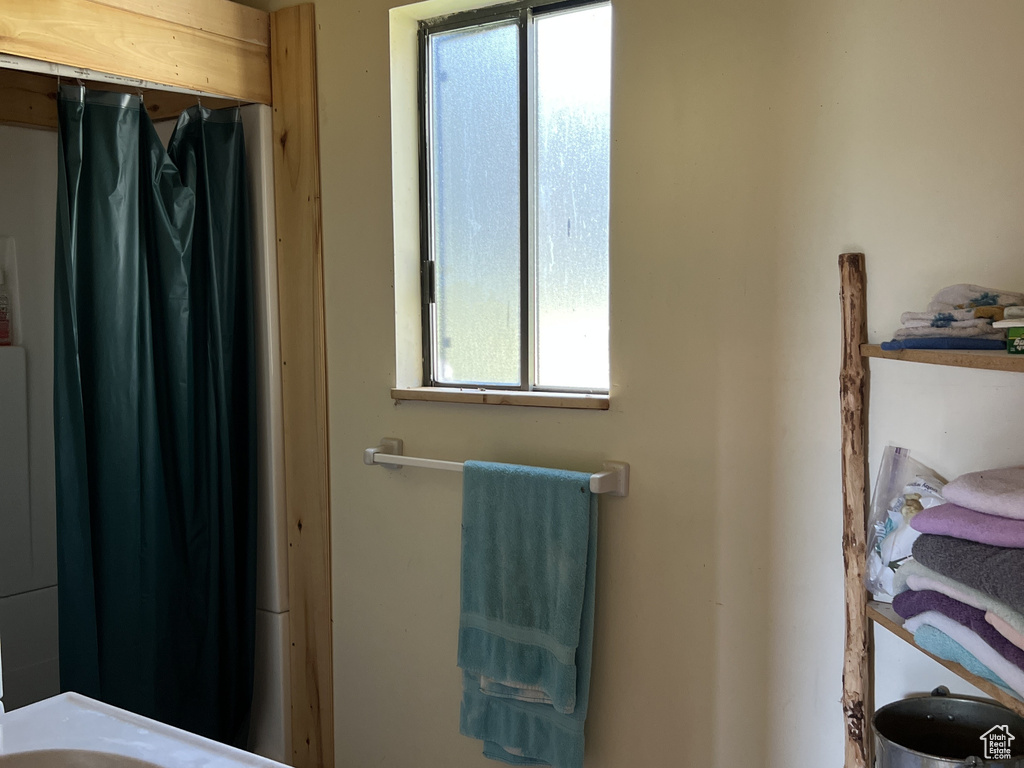 Bathroom with tile patterned floors and vanity