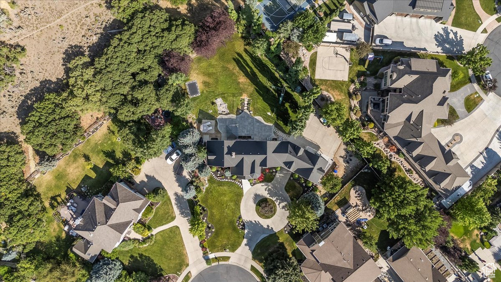 Aerial view of property's location with nearby suburban area