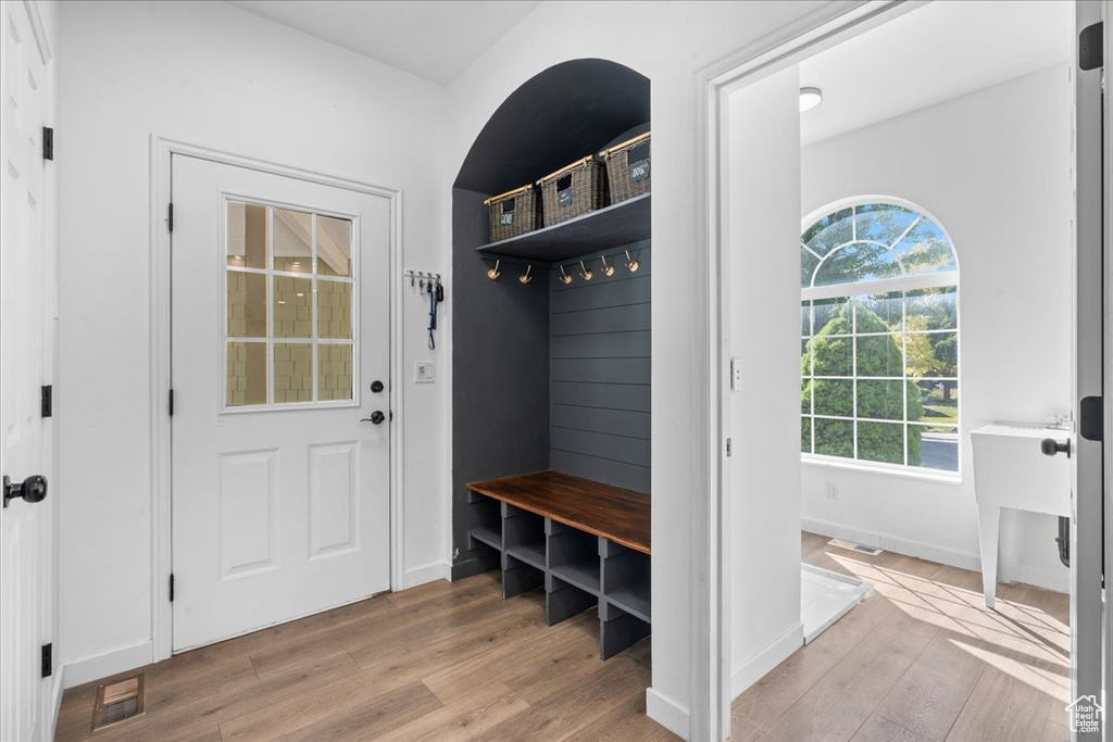 Mudroom featuring light wood-style flooring