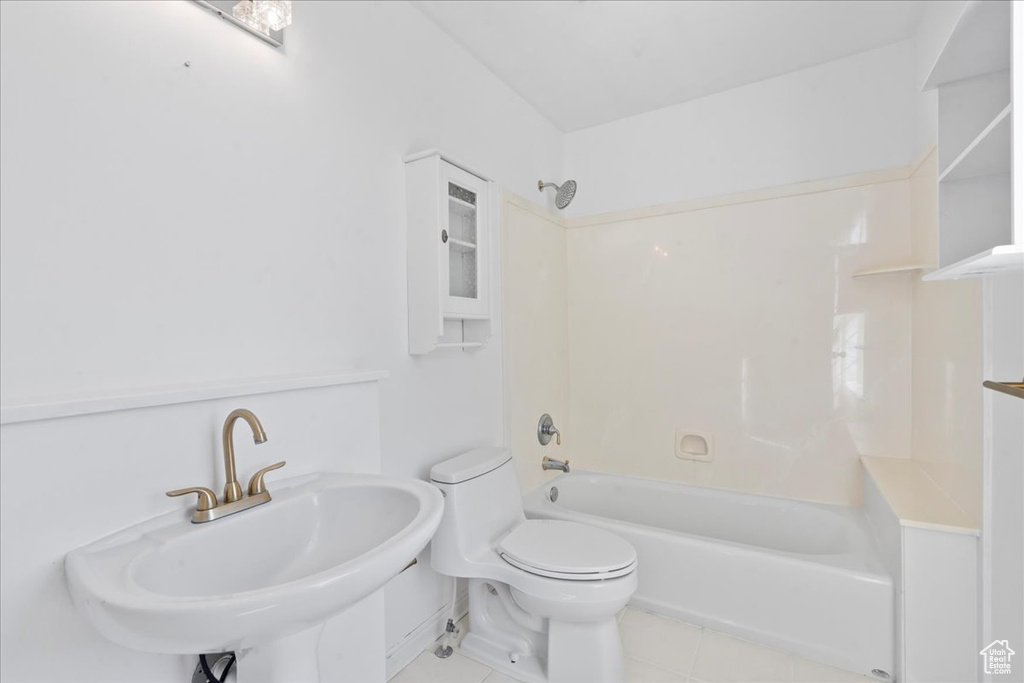 Bathroom featuring tile patterned flooring and bathtub / shower combination