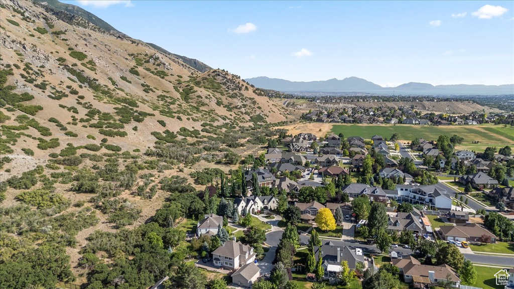 Aerial view of residential area featuring mountains