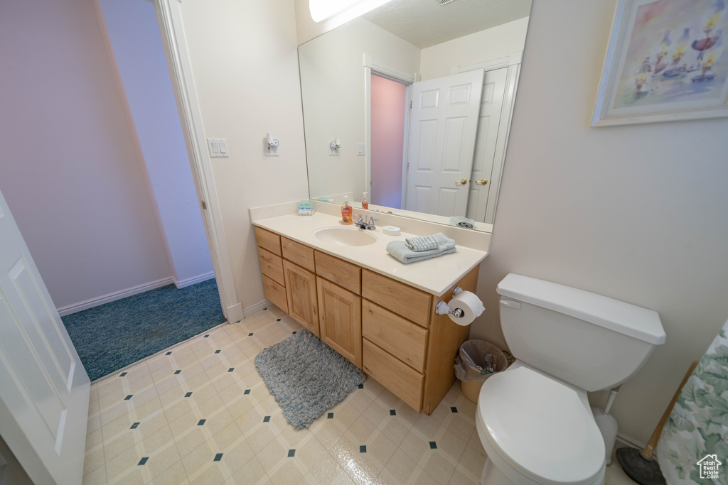 Bathroom with vanity and toilet