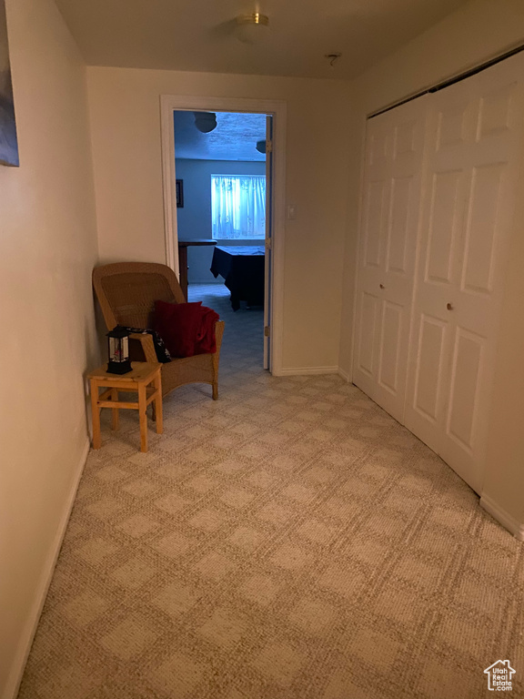Corridor featuring carpet