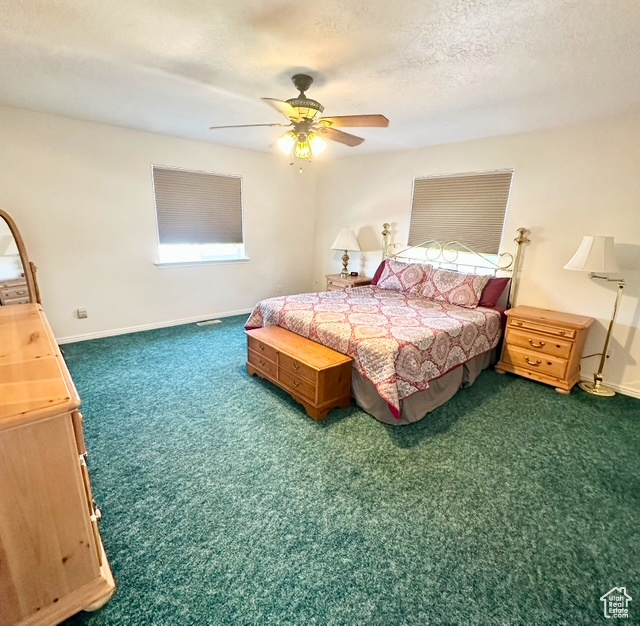 Bedroom with carpet and a ceiling fan