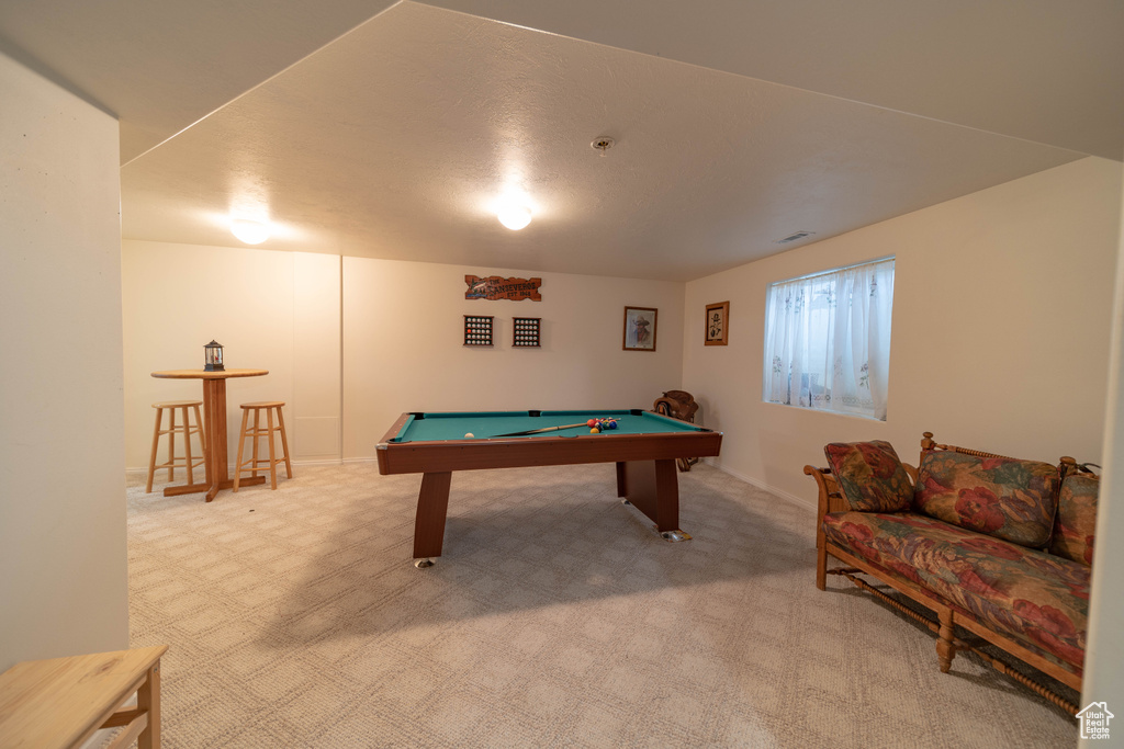Playroom with carpet and billiards table