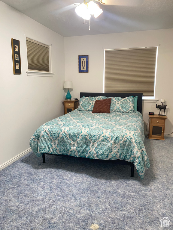 Bedroom with carpet and a ceiling fan