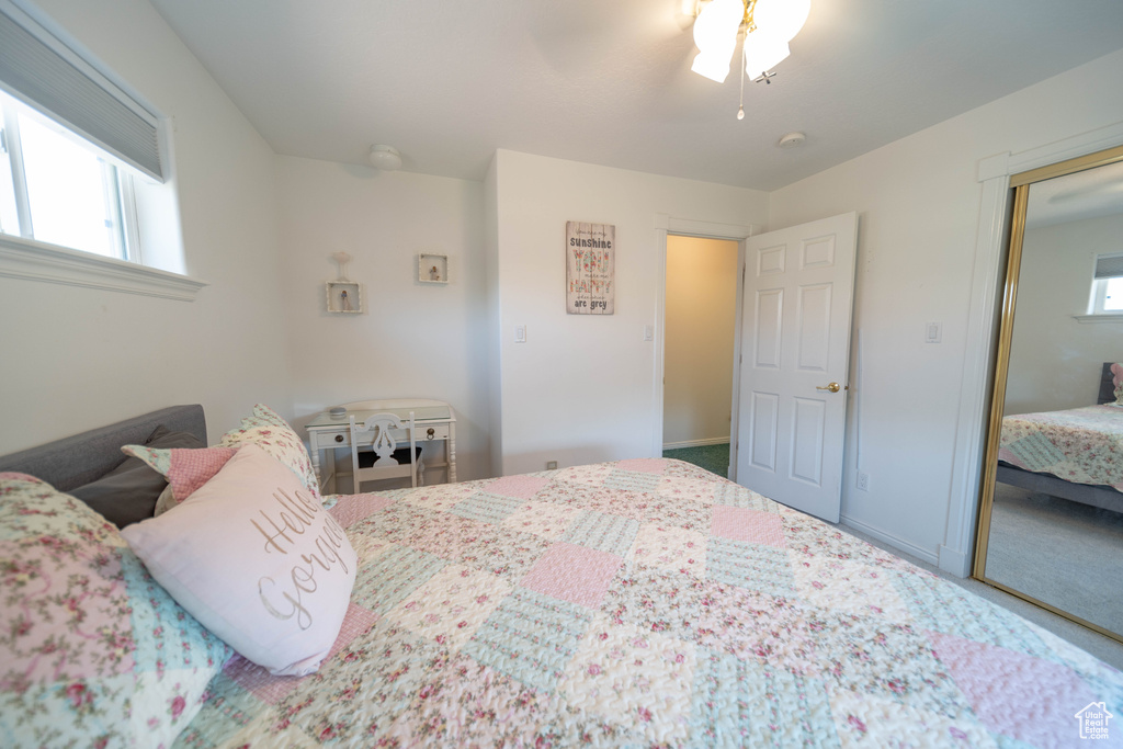 Bedroom featuring a closet, carpet, and a ceiling fan