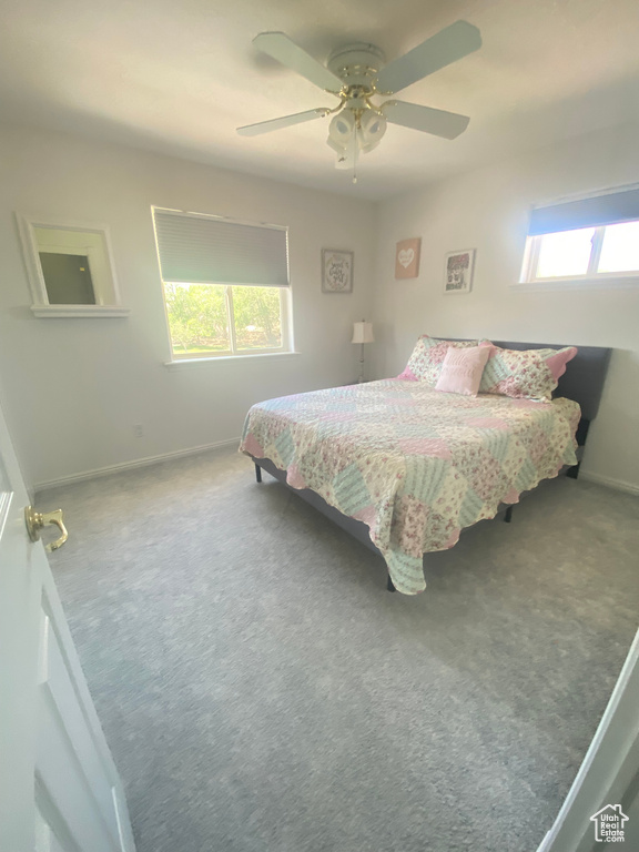 Bedroom featuring carpet floors and a ceiling fan