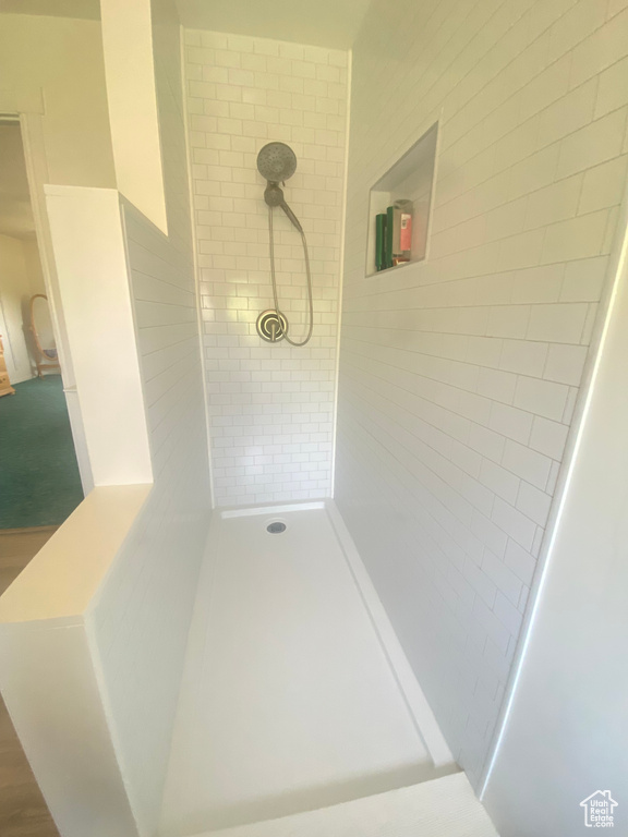 Full bath with a tile shower
