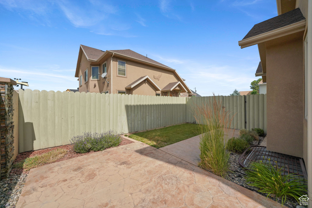 Fenced backyard featuring a patio area
