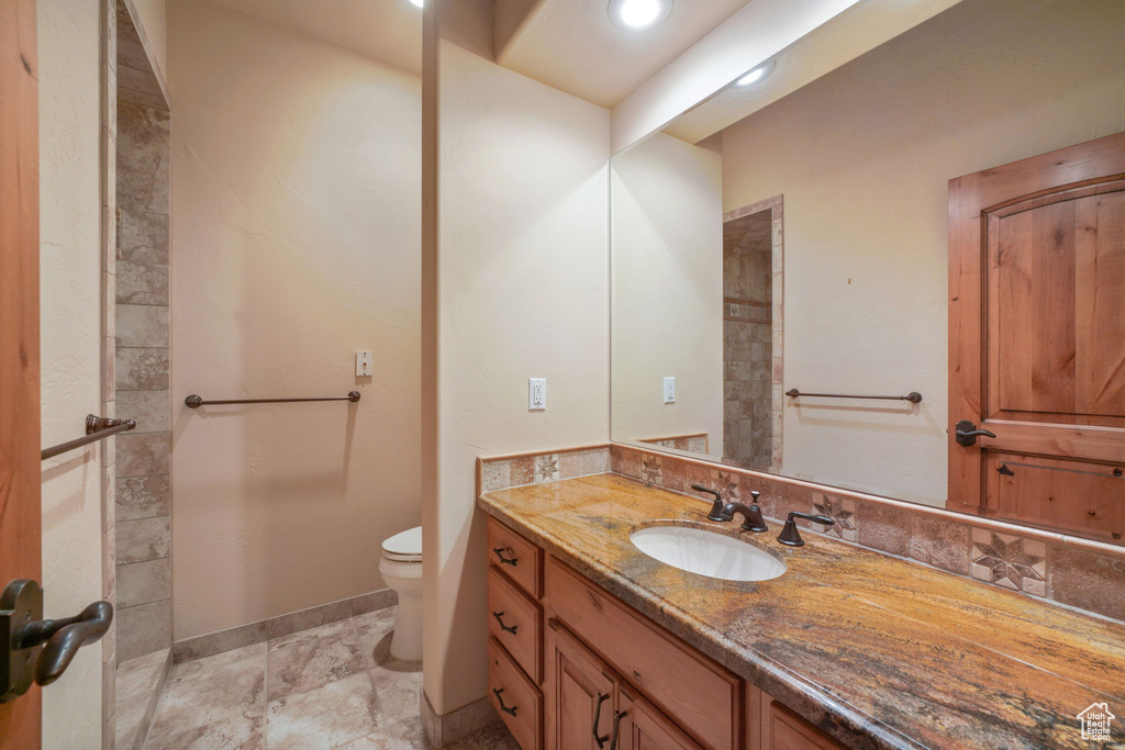 Bathroom with toilet and vanity