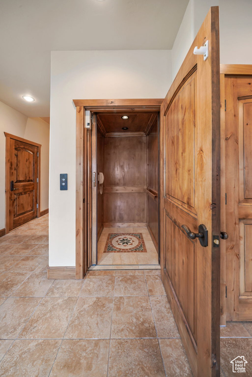 Detailed view of baseboards and recessed lighting