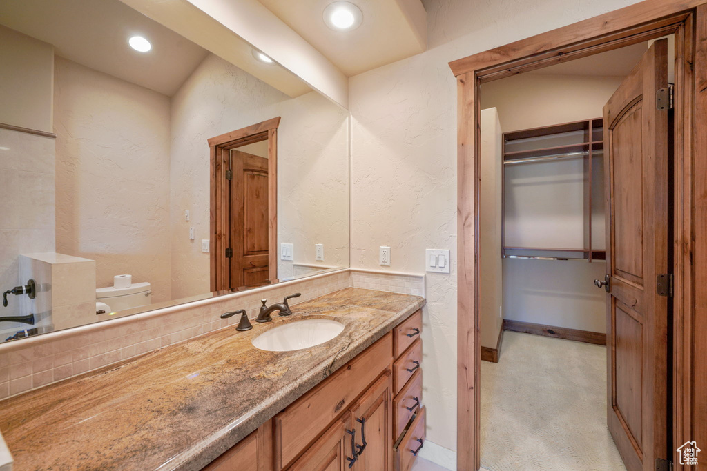 Bathroom featuring vanity and recessed lighting