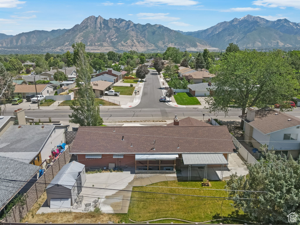 Aerial perspective of suburban area with a mountain backdrop