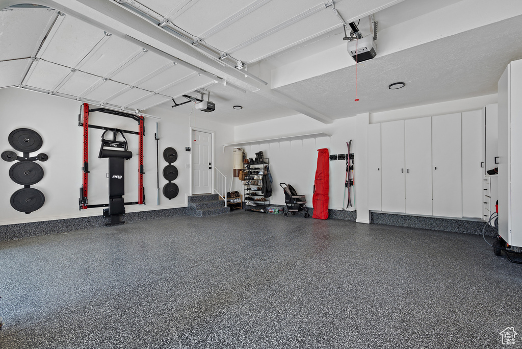 Garage featuring a garage door opener