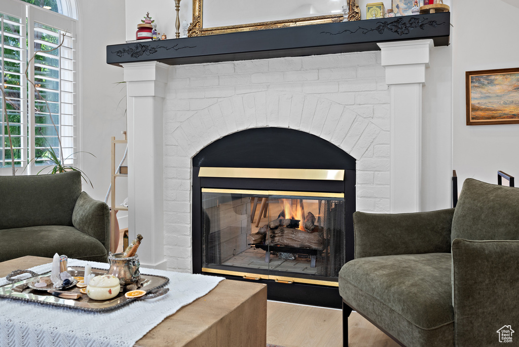 Detailed view of a fireplace and wood finished floors