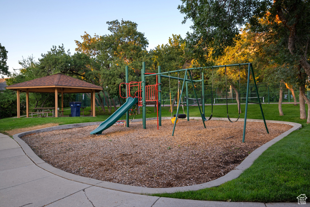 Community jungle gym with a lawn and a gazebo