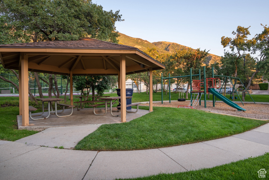 View of home's community featuring a gazebo, a lawn, and a mountain view