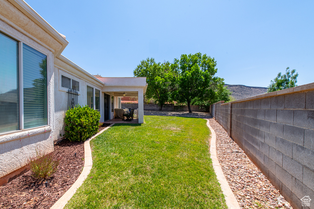 Fenced backyard with a patio area