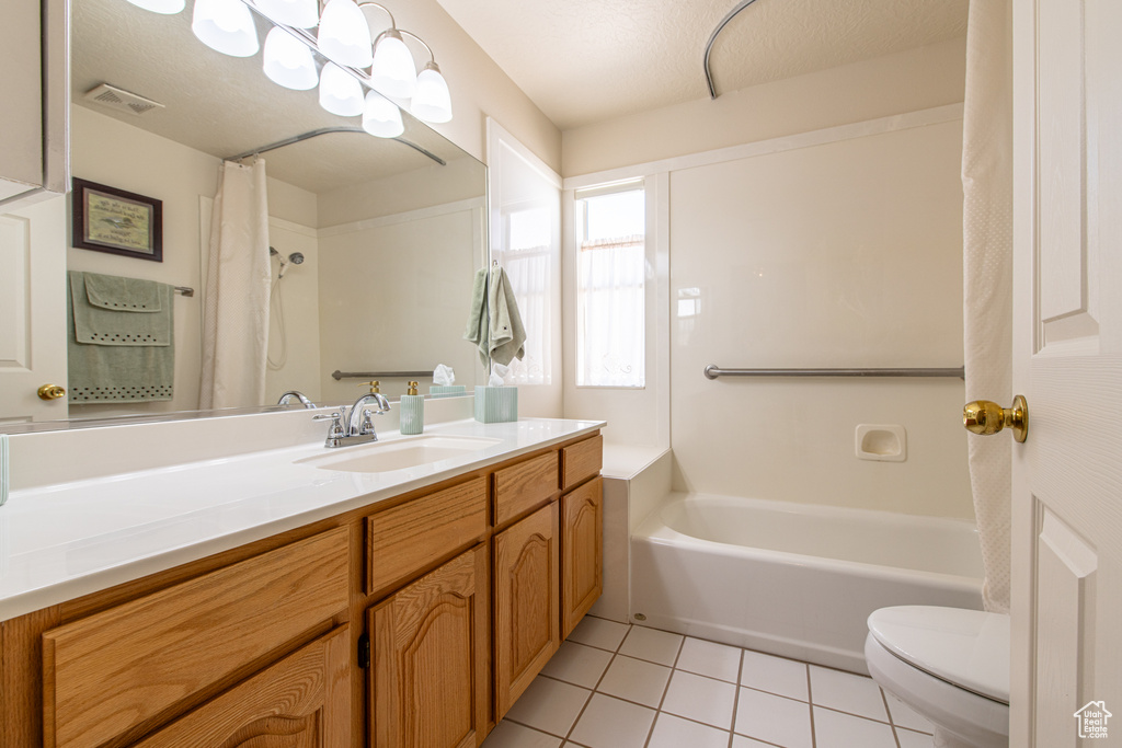 Bathroom featuring vanity and tile patterned floors