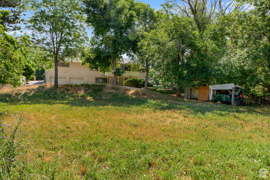 View of yard featuring an attached garage