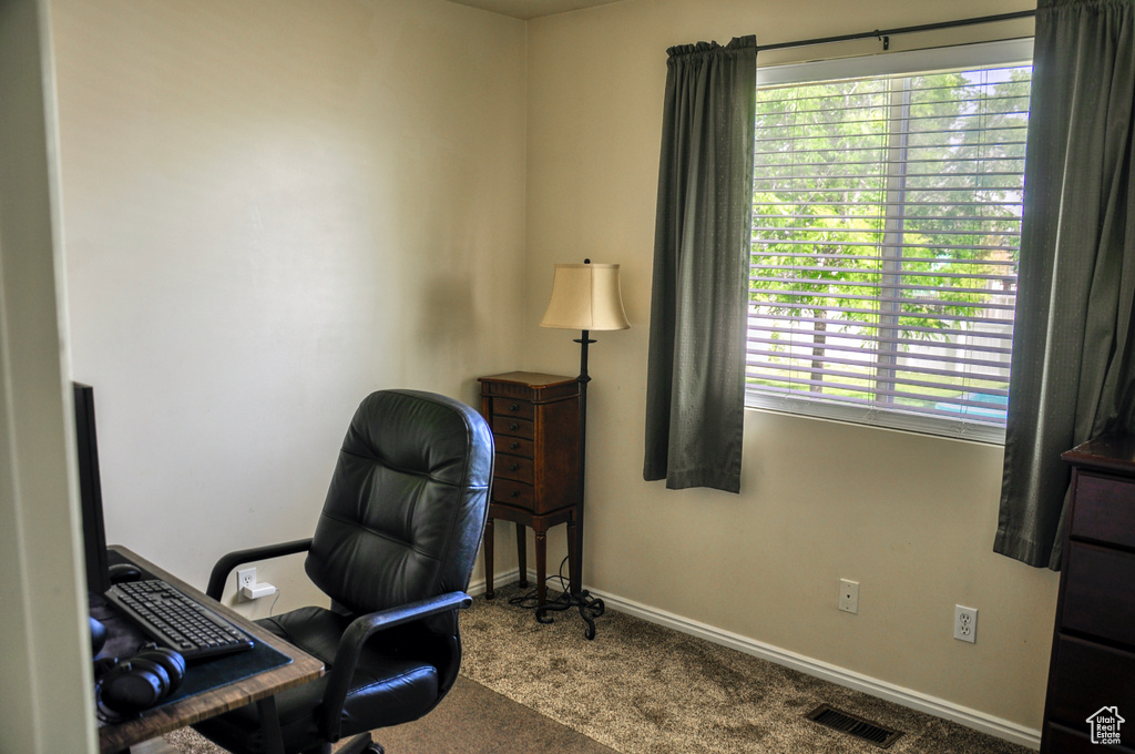 Office space featuring carpet and baseboards