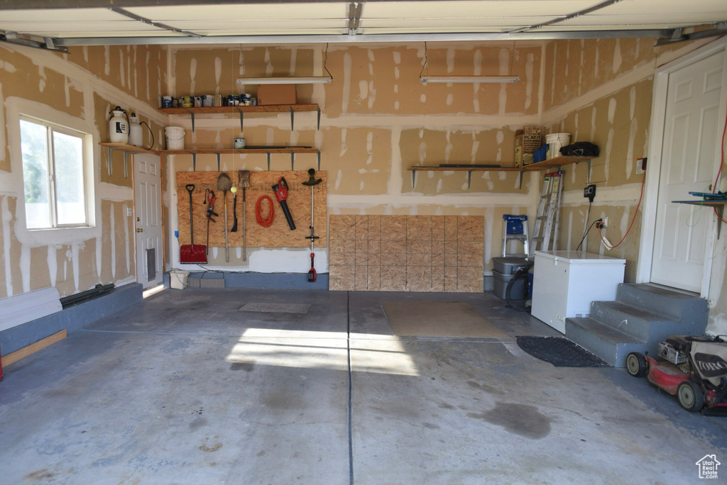 Garage with white fridge