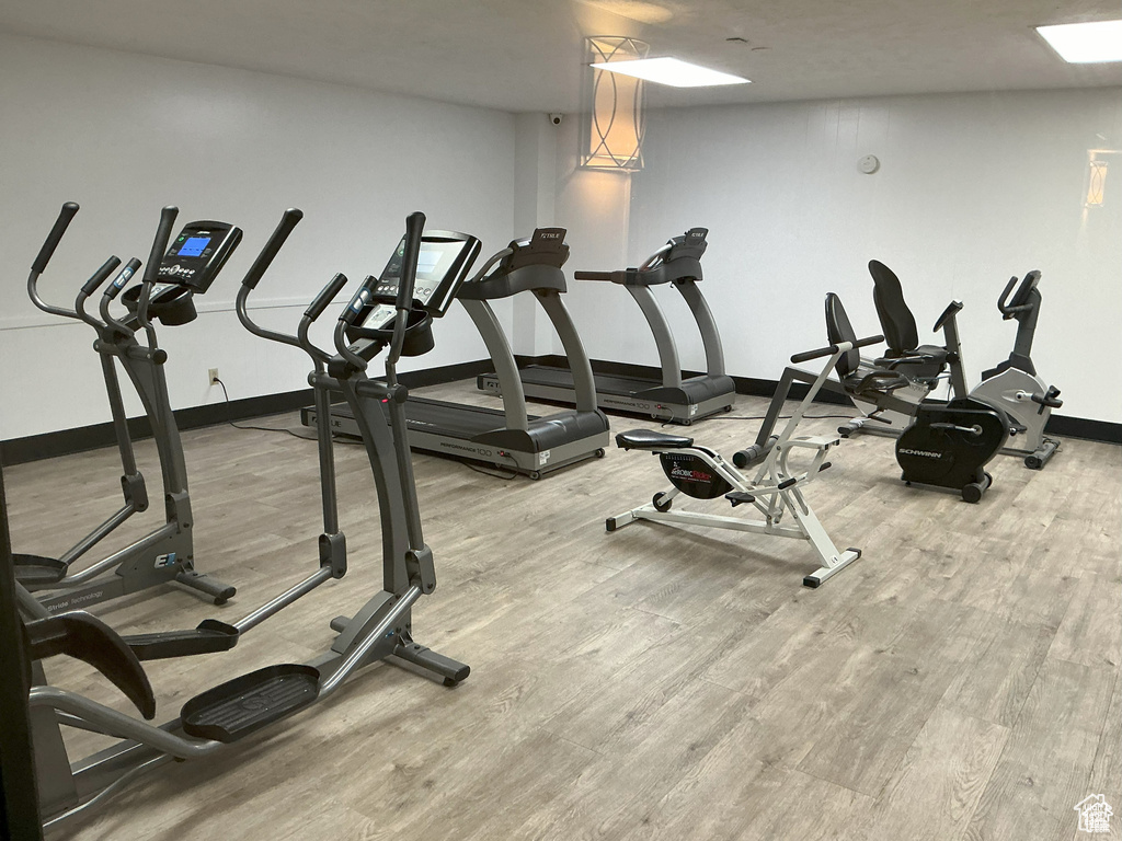 Gym with wood finished floors and baseboards