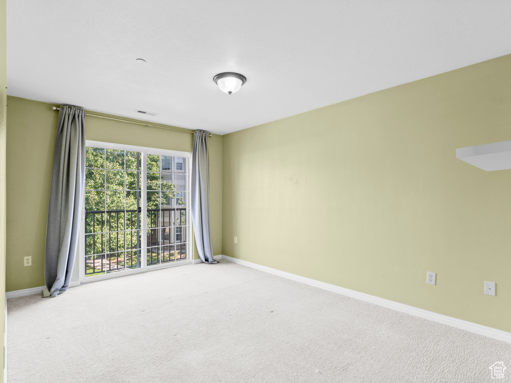 Unfurnished room with baseboards and carpet