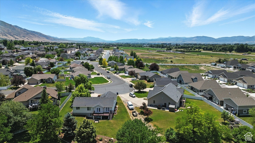 Aerial view of residential area featuring a mountainous background