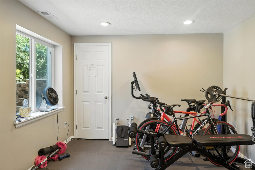 Workout area with recessed lighting and baseboards