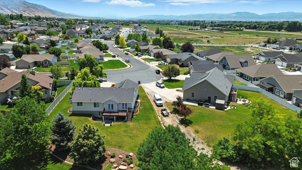 Aerial view of residential area featuring a mountain backdrop