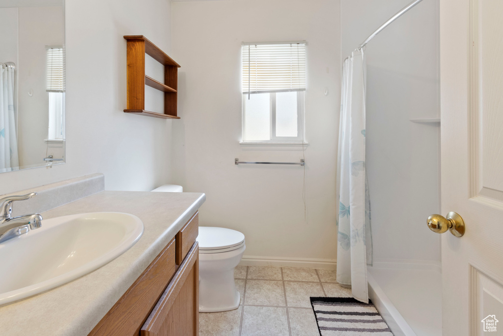 Bathroom featuring vanity and a shower with shower curtain