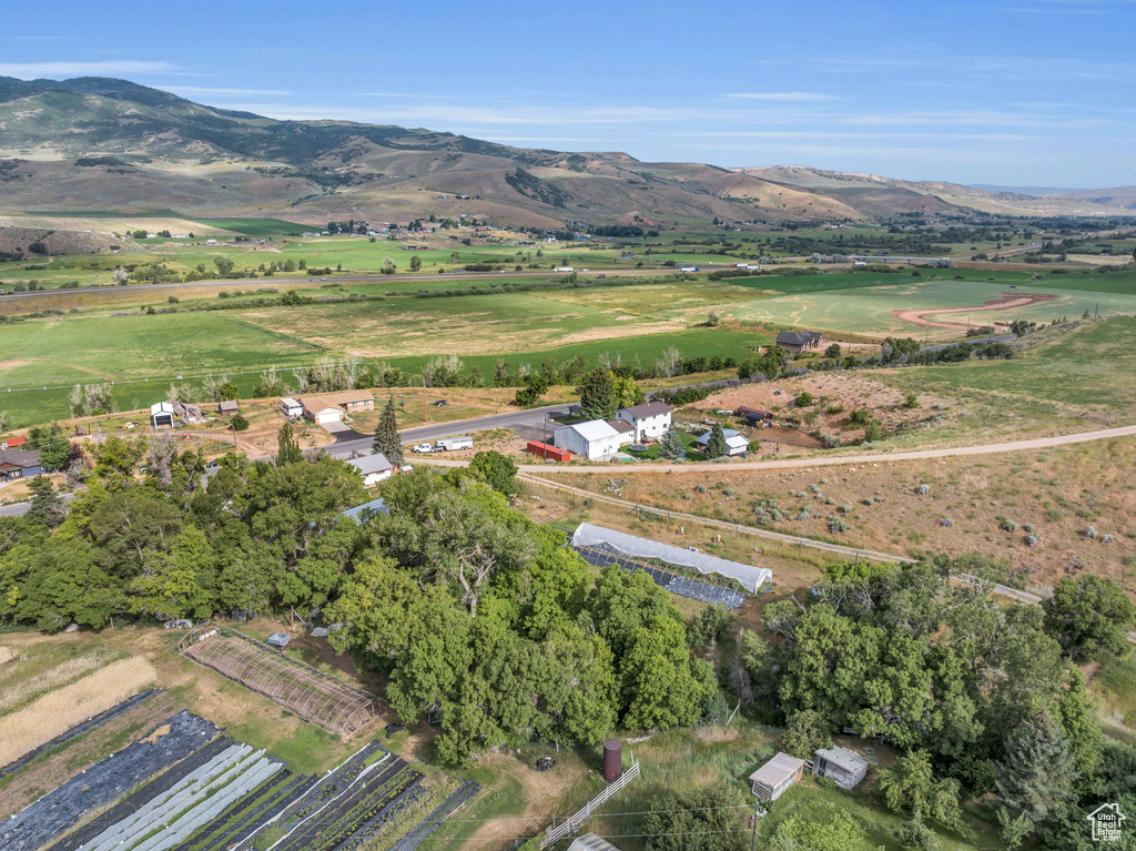 Aerial view of property's location with rural landscape and mountains